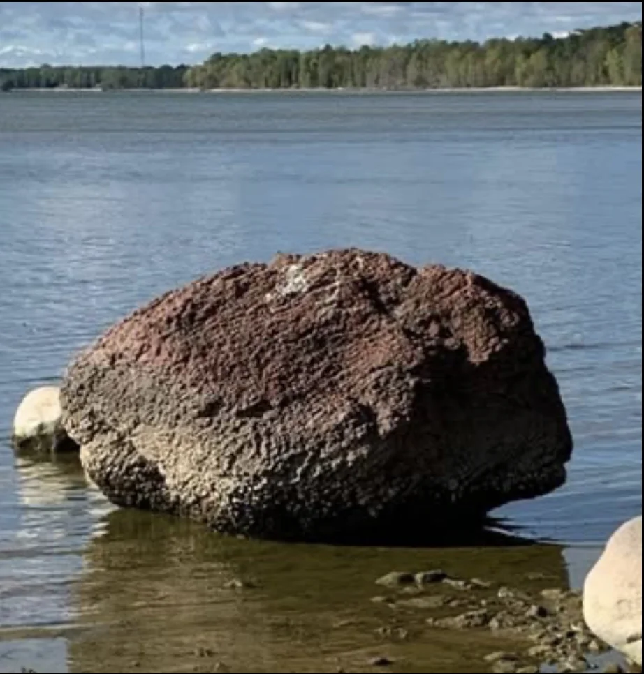 The red rock in the shallows at Rochereaux Point