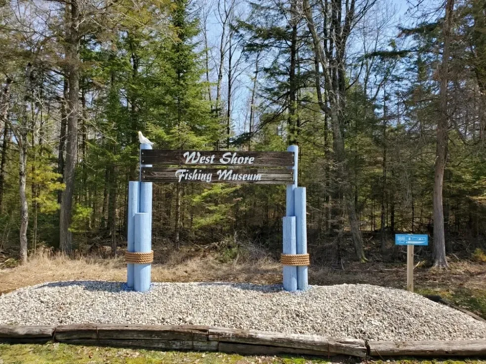 West Shore Fishing Museum entrance sign on M-35