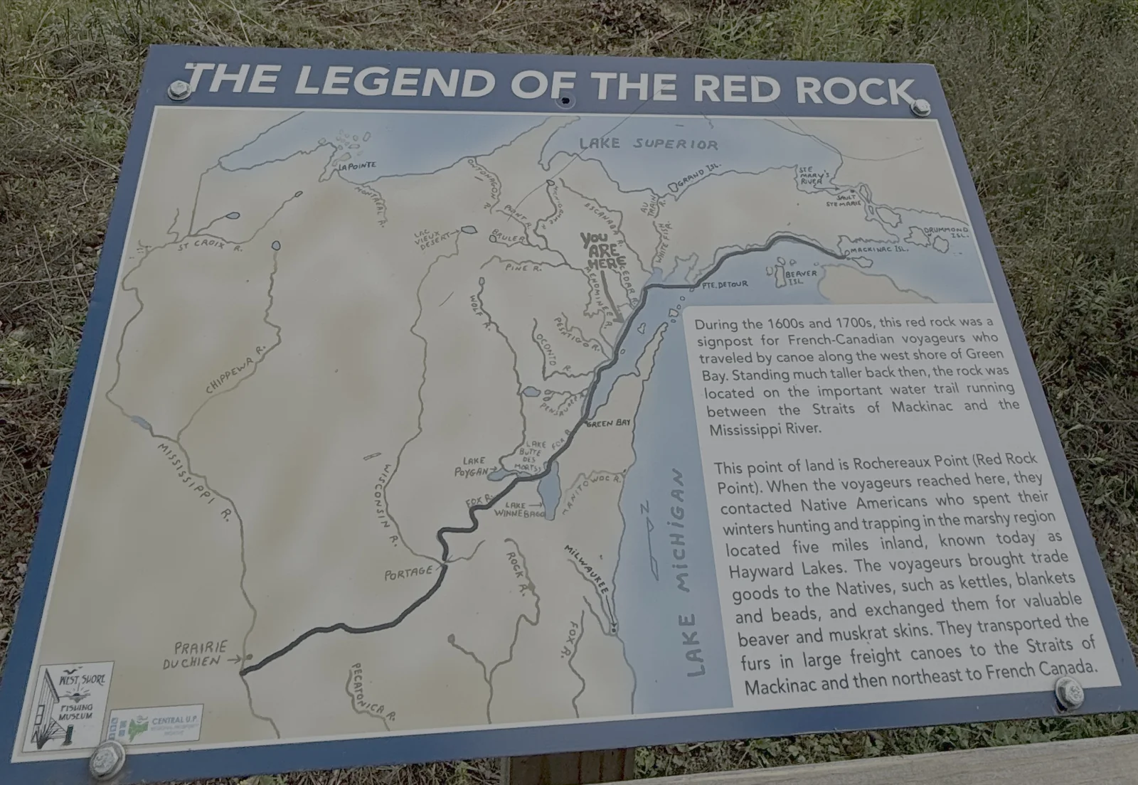 The Legend of the Red Rock interpretive sign, with a map of the voyageur water trail from Mackinac to the Mississippi